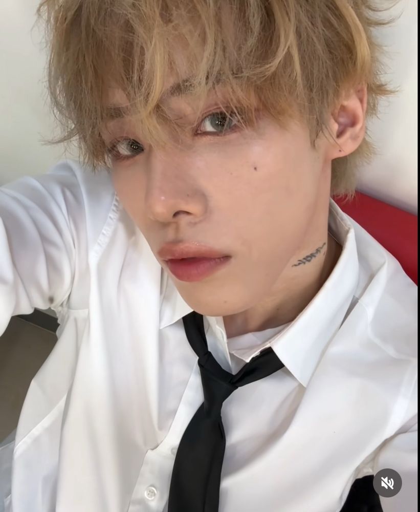 Xen from Omega X in a white shirt and black tie