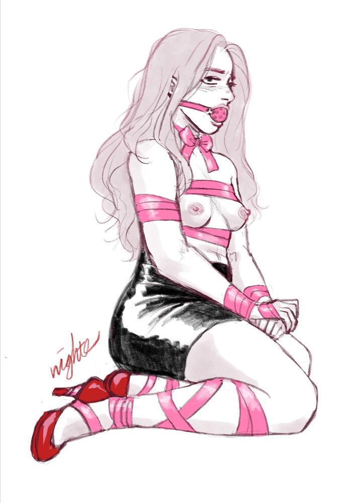 A woman sitting on her knees with legs to one side; she’s wearing a pink ball gag, red high heels and a tight short black skirt. She has been decoratively wrapped and bound with a wide pink band.
