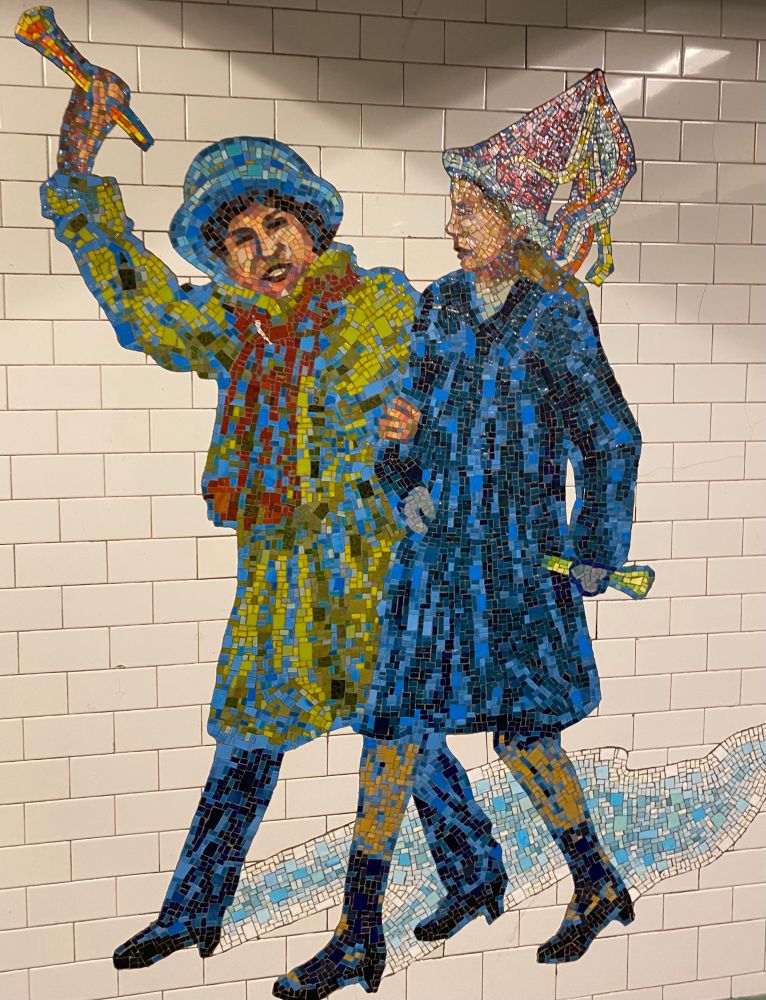 Mosaic from the NYC subway depicting two people celebrating the New Year.