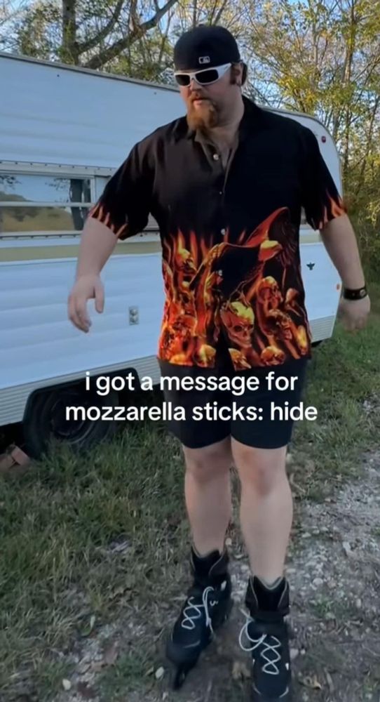 a goateed man in a black and flame button up, shorts, white sunglasses, and a backwards cap stands in roller blades next to an RV. The caption reads "I got a message for mozzarella sticks: hide"