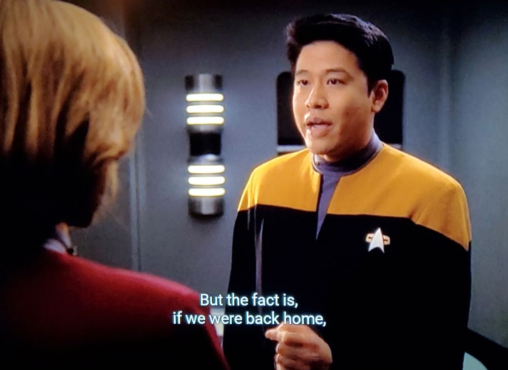 Voyager scene. Harry Kim is talking to Captain Janeway over a series of 4 screenshots. They're in normal uniforms and standing in the captain's ready room, otherwise alone. First three screens are focused on Harry earnestly speaking his truth. Closed caption reads, "But the fact is, if we were back home, I'd be a lieutenant by now, maybe even a lieutenant commander."
Final screen is Janeway, leaning back, arms crossed, with large exaggerated smile and a note of smugness. Closed caption reads, "You're pretty sure of yourself, aren't you?"