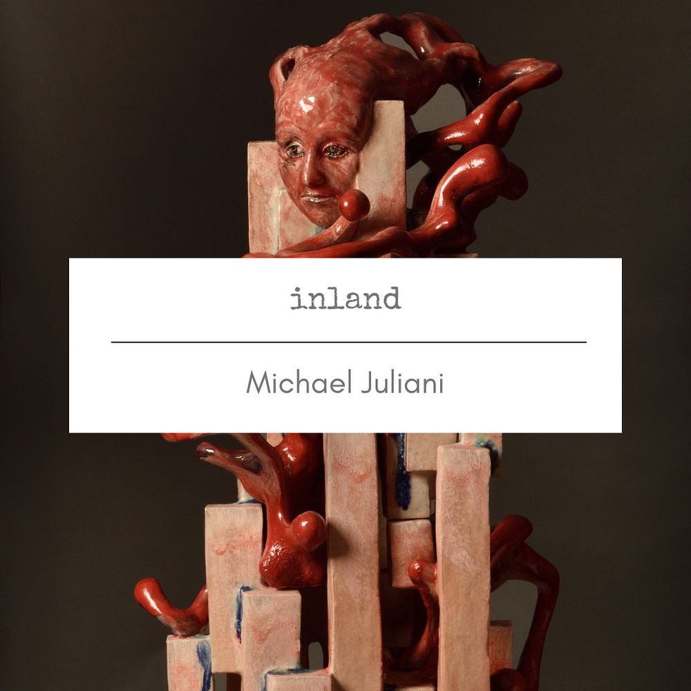 Glazed ceramic piece with a face and title card on top: “Inland” by Michael Juliani