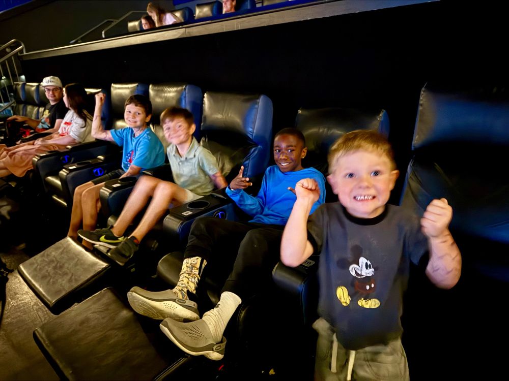 Excited kids in the movie seats.