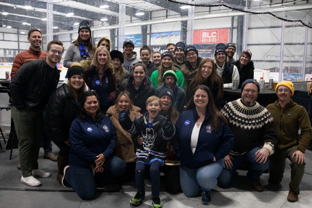 Group photo of NSL staff and Washoe County Leadership Academy at the ice rink.
