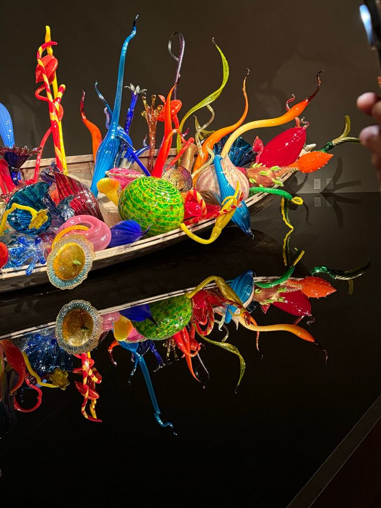 Ikebana boat filled with colorful glass shapes