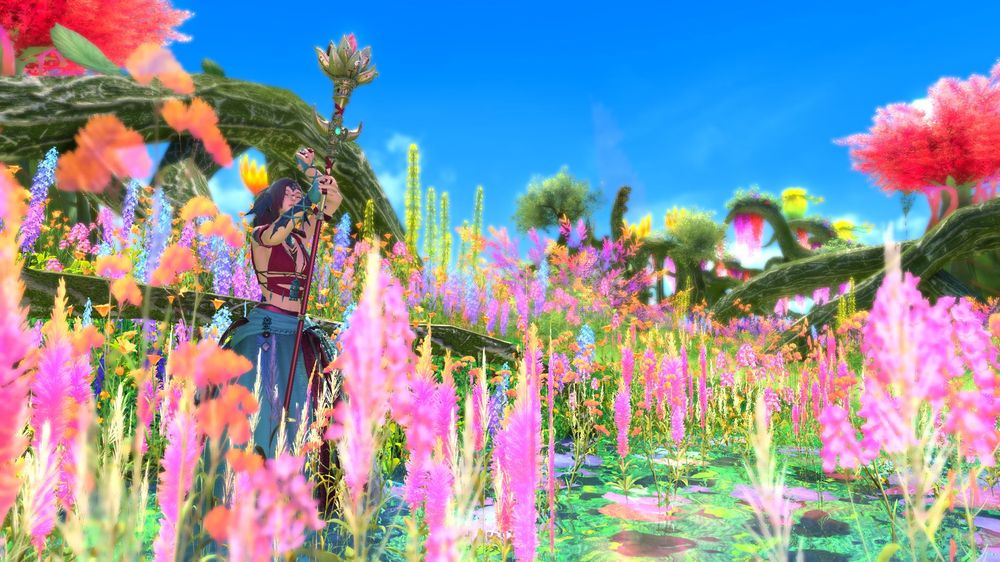 A character staying in a soft floated area. A lot of different pink, yellow and orange flowers are around her. Shes casting a spell with her druid staff, which opened like a flower itself