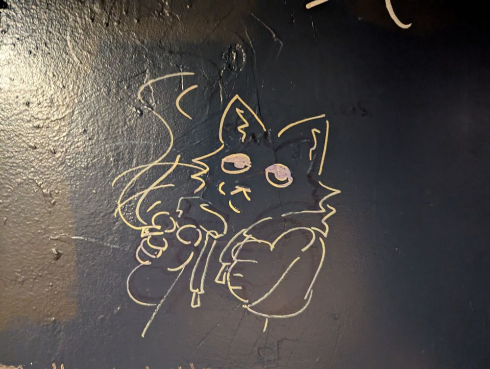 Doodle of a humanoid cat wearing a hoodie and smoking