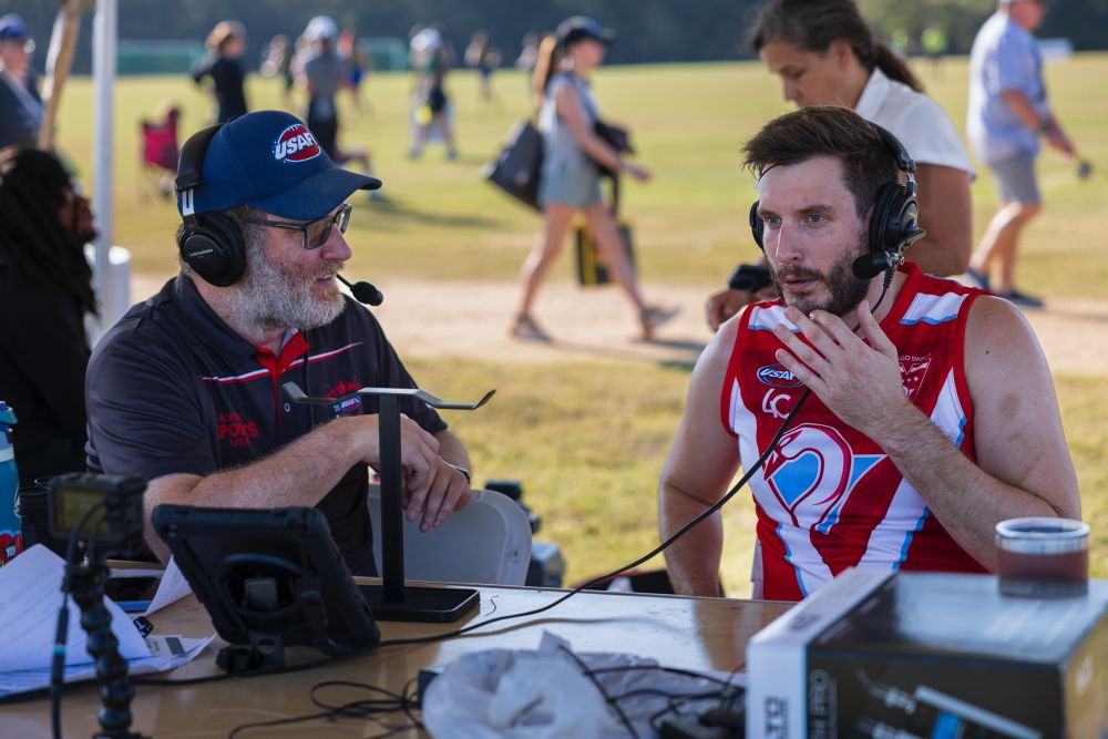 Brian interviewing an Aussie Rules player.