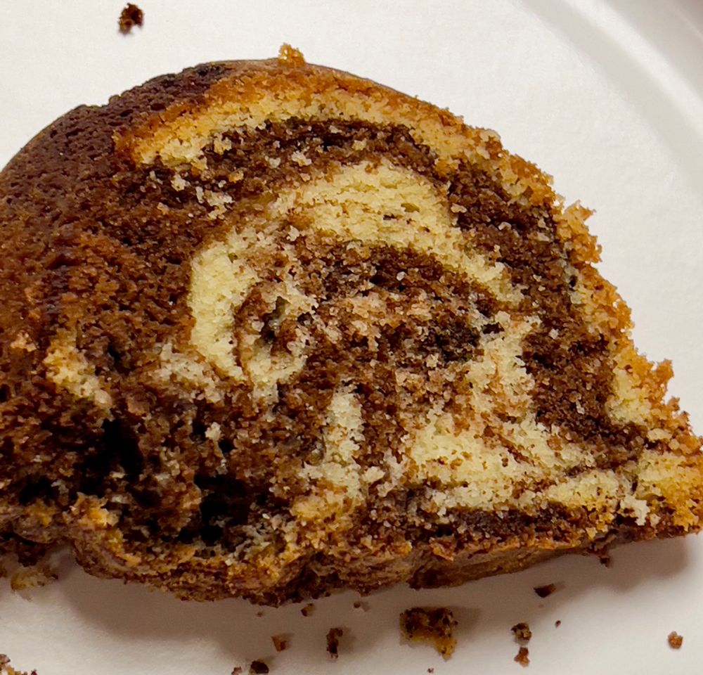 A beautifully-swirled piece of marble cake, chocolate and vanilla.