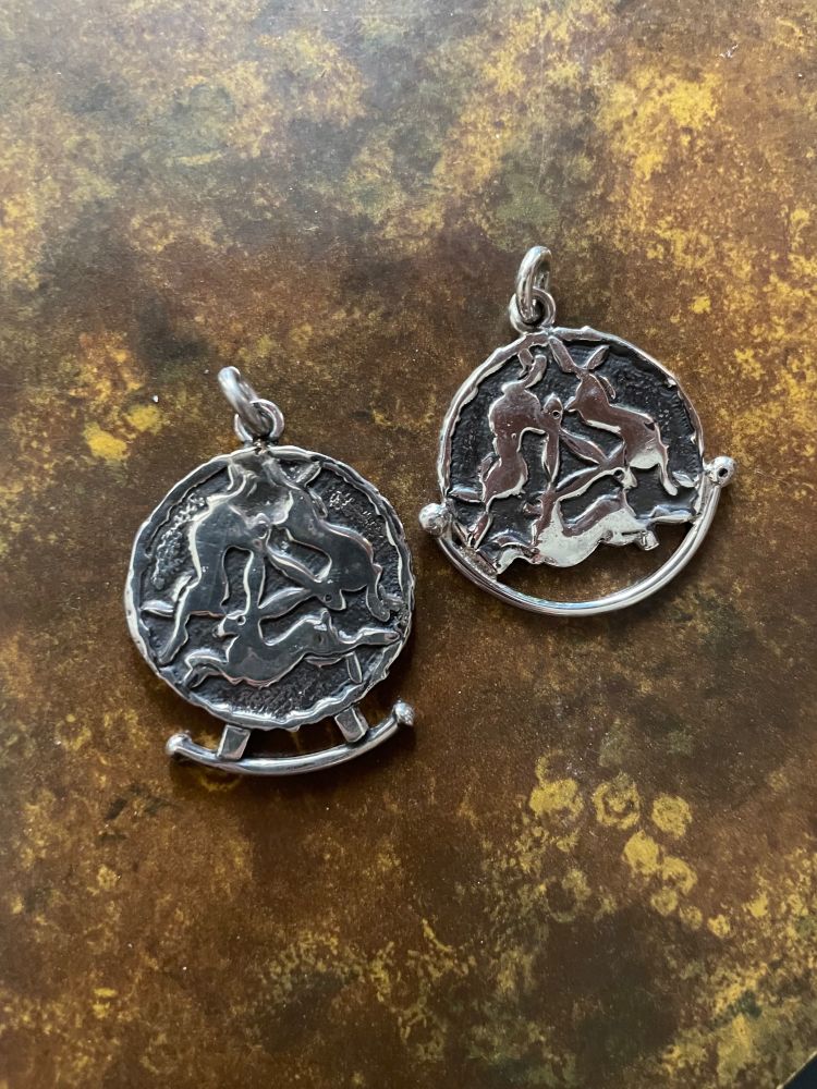 Two silver talismans of triple hares 