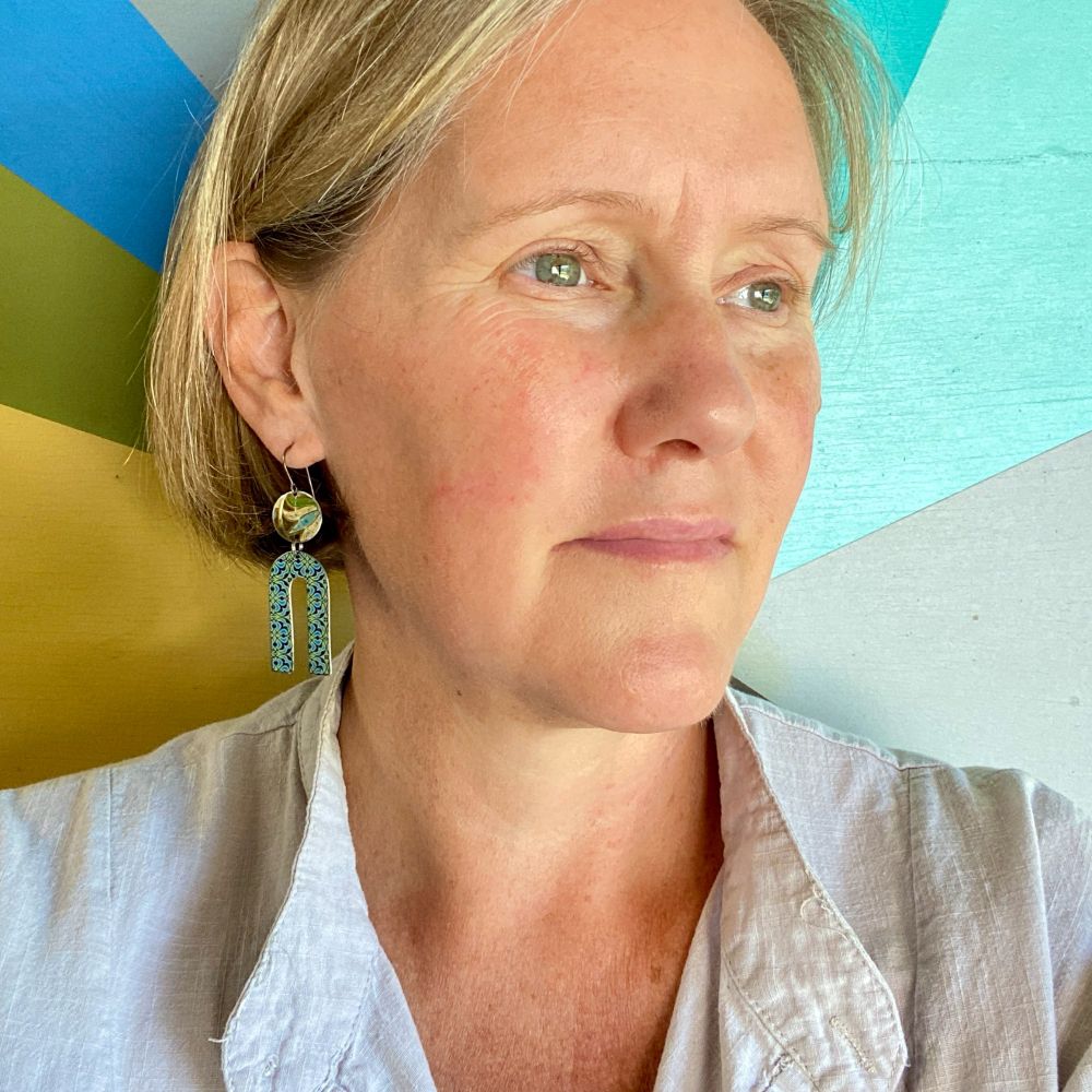Upcycled tin earrings by Christine Terrell of adaptive reuse jewelry. 