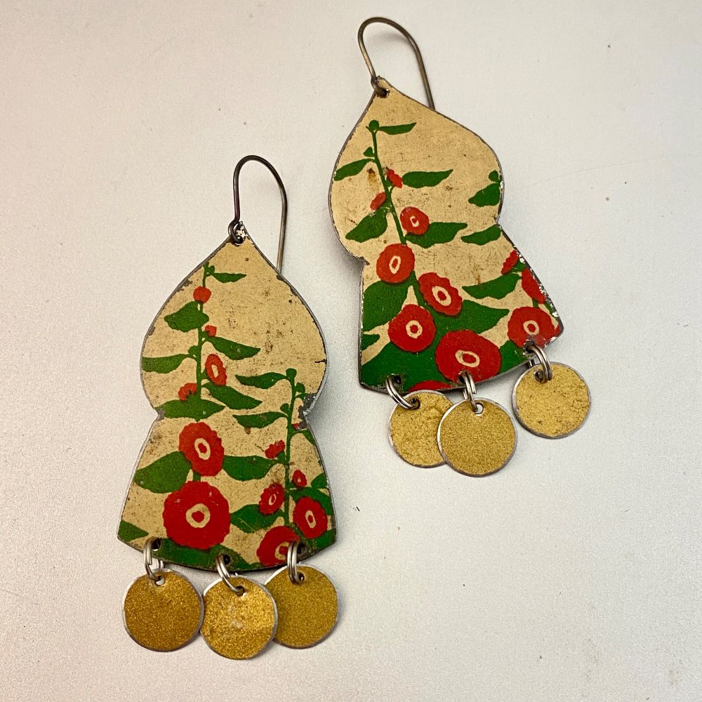 Upcycled vintage tin earrings with a hollyhock pattern. 