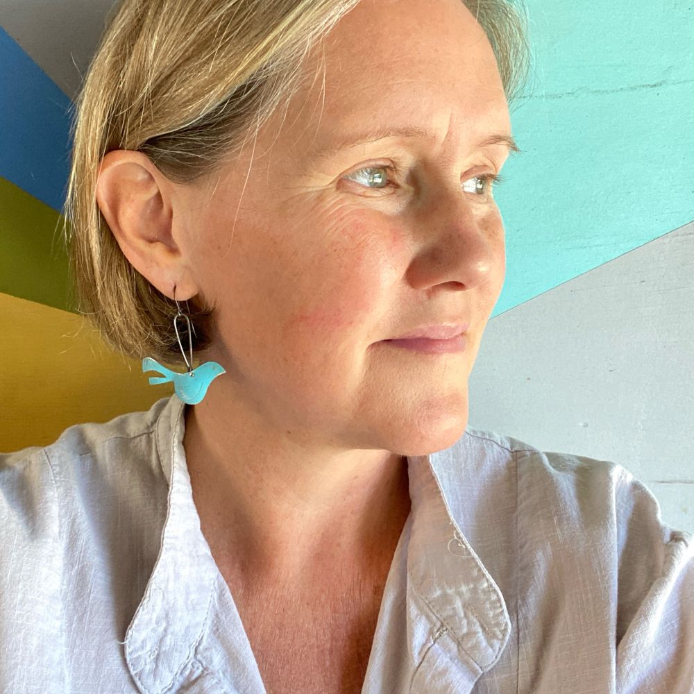 Little blue bird earrings made from upcycled tin. 
