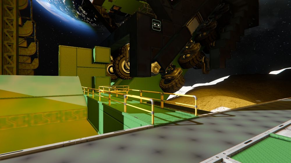 A walkway with railing from the landing pad to the base of the incline. The structure is all green, the railings are yellow.