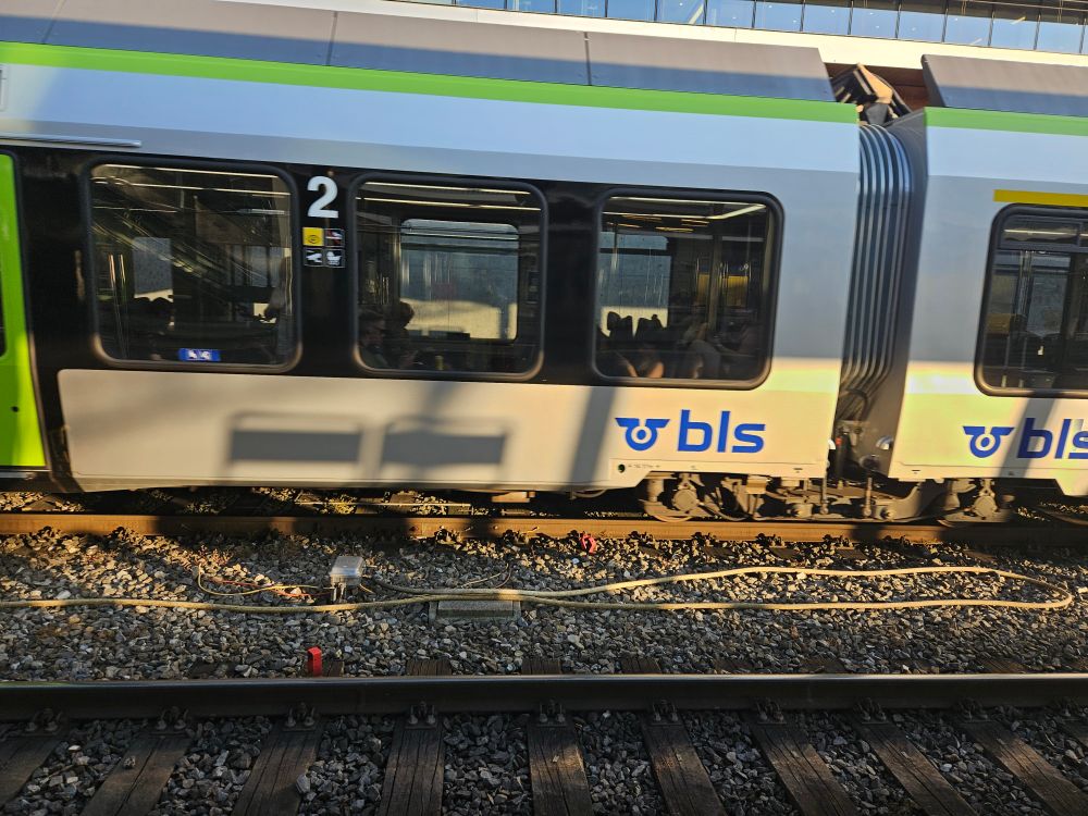 A picture of a train with a BLS brand on it. 