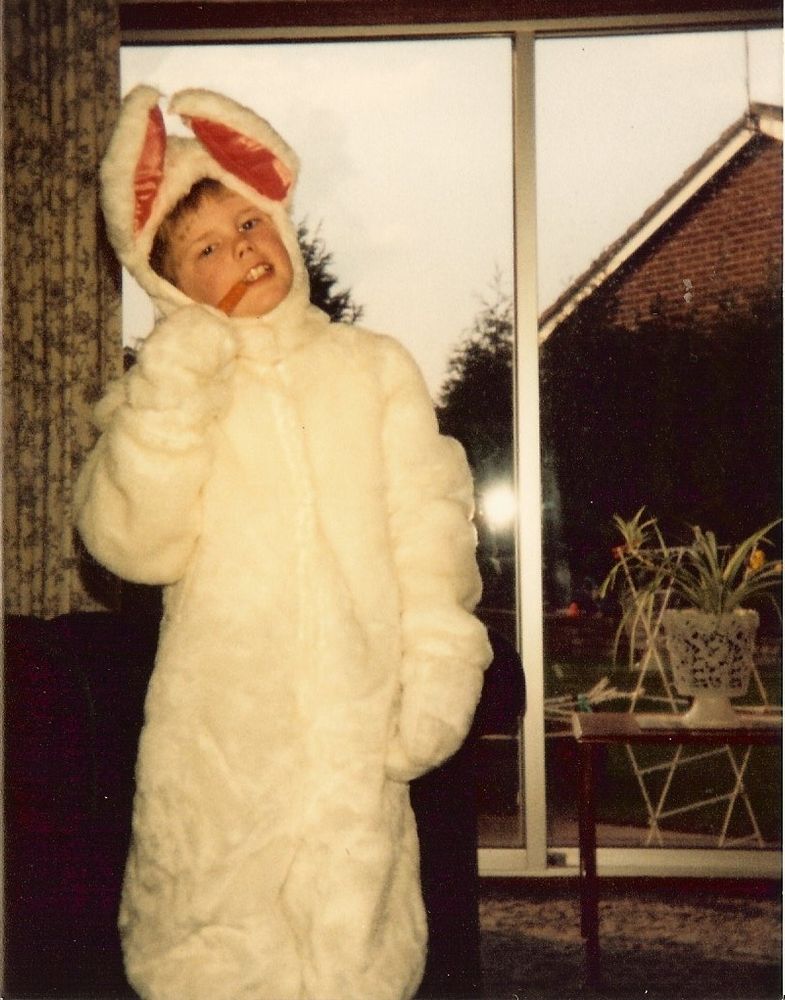 Me eating a carrot in my "White Rabbit" costume I wore in our school play of Alice in Wonderland in April 1984 aged 9