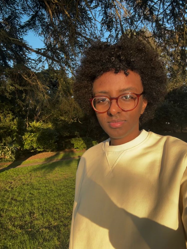 selfie of me in a park. it is golden hour