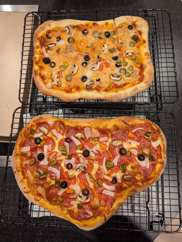 Hannah's rectangular vegan supreme pizza and my misshapen supreme pizza!