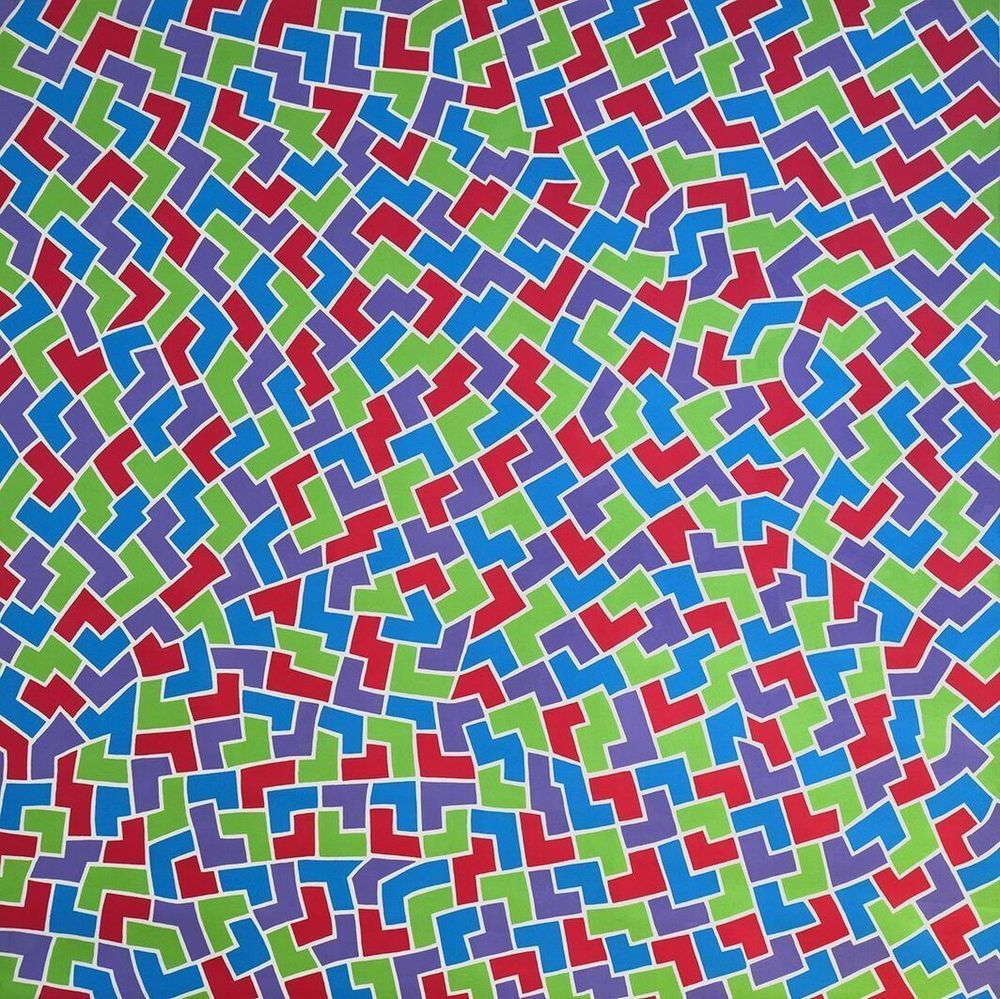 Abstract painting with interlocking V, Y, and L shapes in alternating green, red, purple, and blue, all outlined in white.