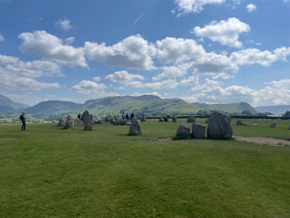 Castlerigg Stone Circle on a sunny day looking south towards Helvellyn