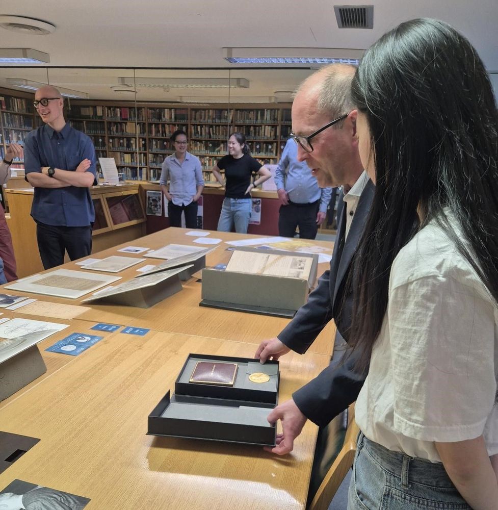 Director Allen showing a visitor a Nobel Prize