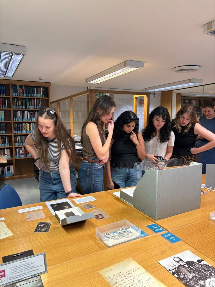 Photo of students looking at archive material