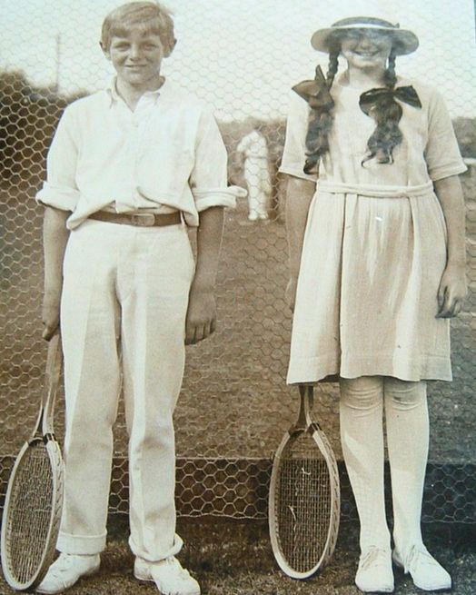 Randolph and Diana Churchill, Clementine and Winston's eldest children, standing next to each other, dressed in tennis whites, holding tennis rackets in their right hands, CSCT 5/5.