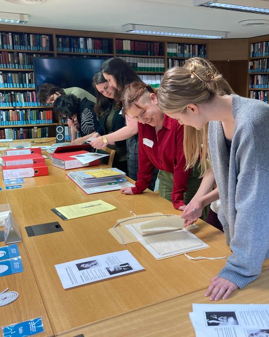 Induction day attendees identifying material for a display