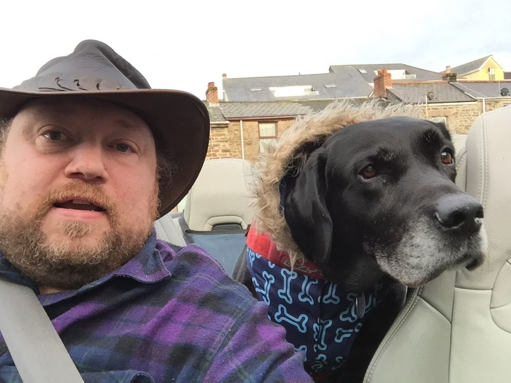 Me and my lovely boy, Bailey, now sadly passed, enjoying our convertible. Coat because it could get a bit windy and chilly for the lad. 