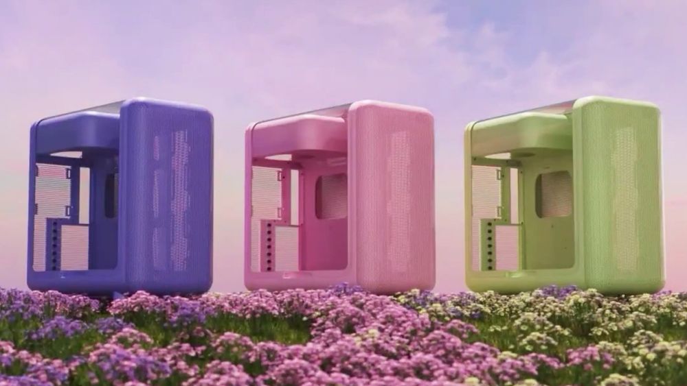 3 Computer cases from Hyte in different colors. From left to right: Purple, Pink ,and Green 