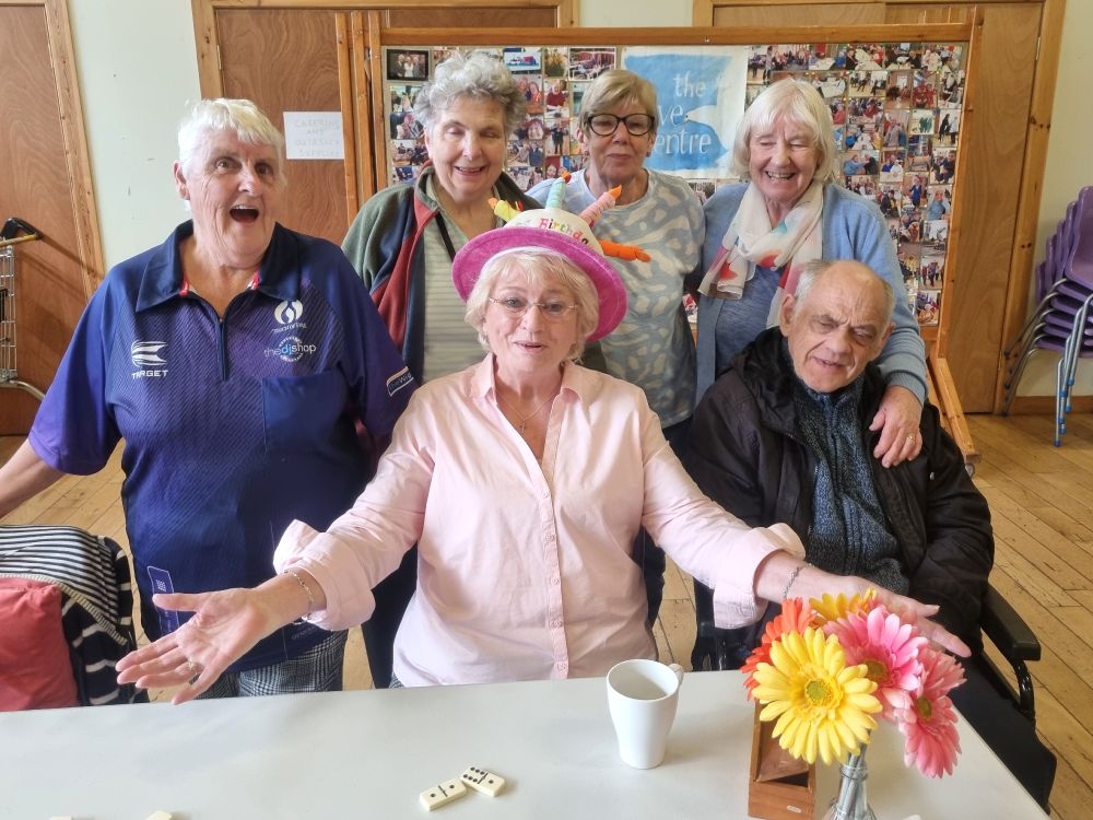 Photo of Dove Centre service users celebrating birthdays. 