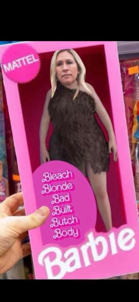 Mattel toy doll box with Marjorie Cavewoman Greene inside. Box reads ‘Bleach Blonde Bad Built Butch Body Barbie’