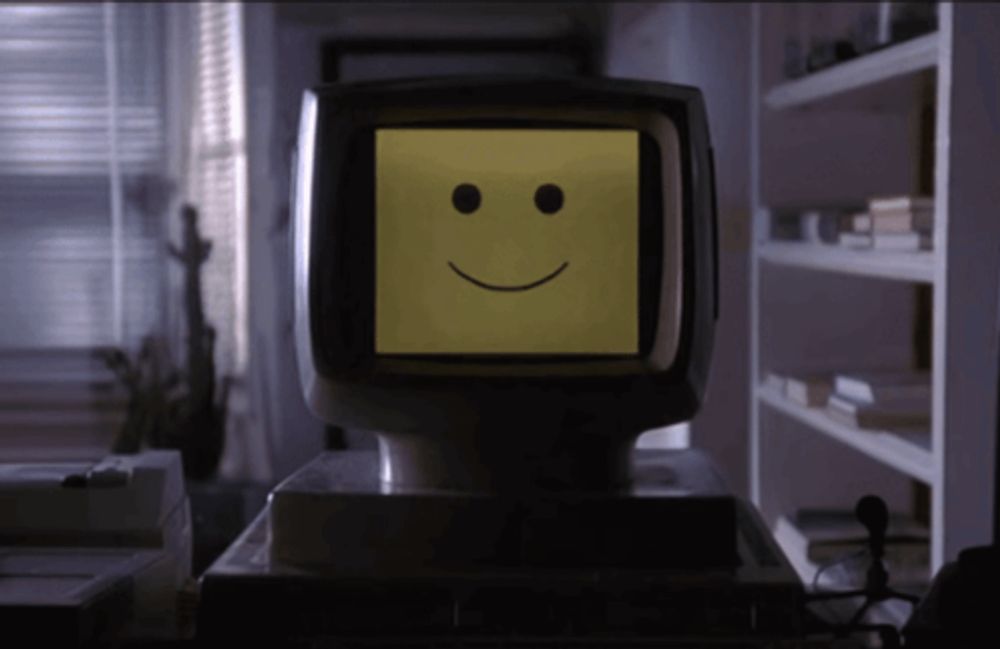 a yellow smiley face is on a television screen