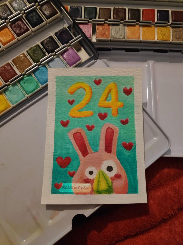A pink Freezer Bunny holding a green plumbob. The number 24 is floating above the Freezer Bunny. Red hearts all around on a turquoise and teal gradient background.