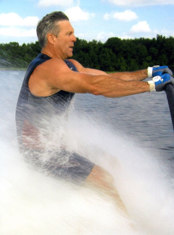 Ron Zook barefoot skiing behind a boat and looking buff as hell. 