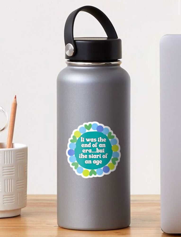 “It was the end of an era…but the start of an age” surrounded by a friendship bracelet sticker displayed in a gray water bottle 