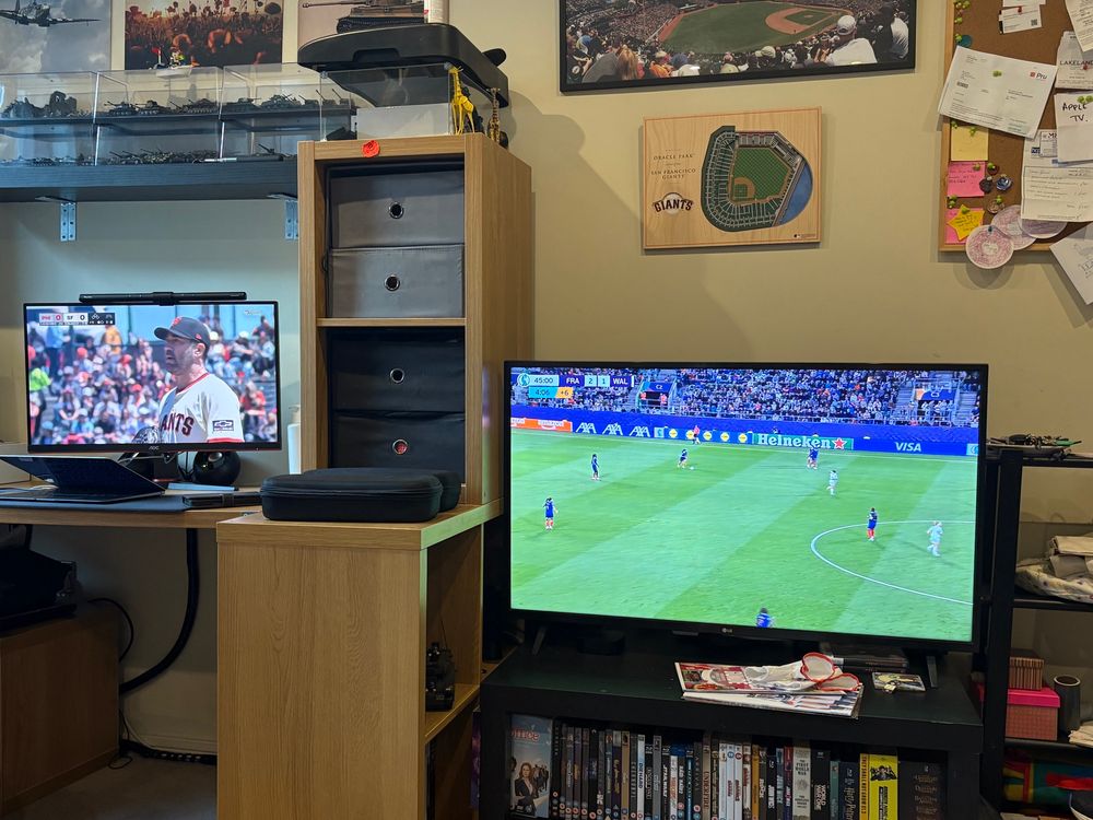 Screen with Giants baseball game and second screen with Euros