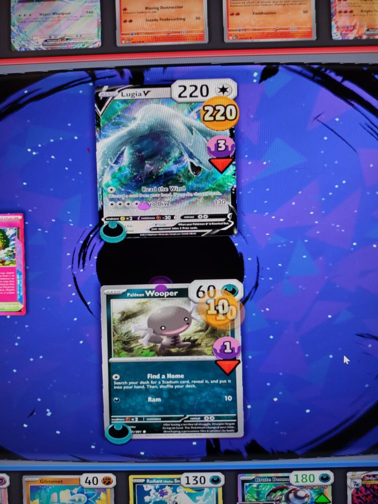 Ptcg live game showing a paldean wooper (aka a pooper, cause it's a brown wooper) FUCKING KILLING A LUGIA V