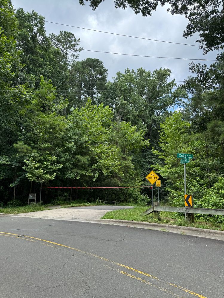 The top of Laurel Hill Road blocked off by red "Danger" tape