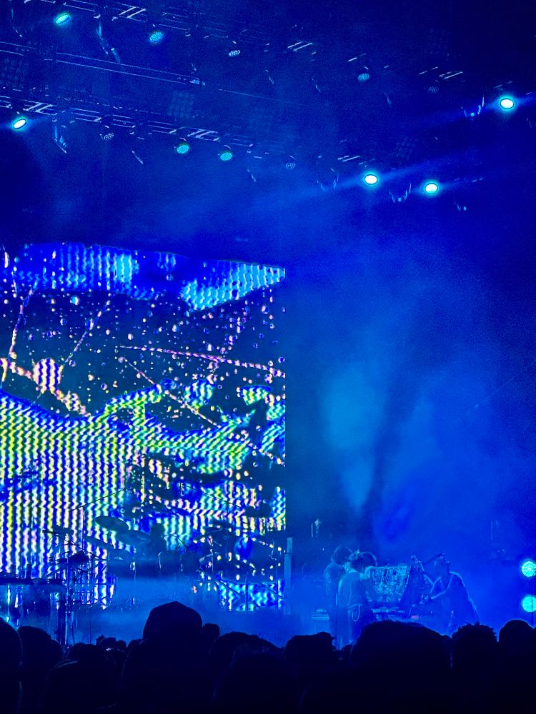 King Gizzard and the Lizard Wizard on the stage playing on Nathan the synth table