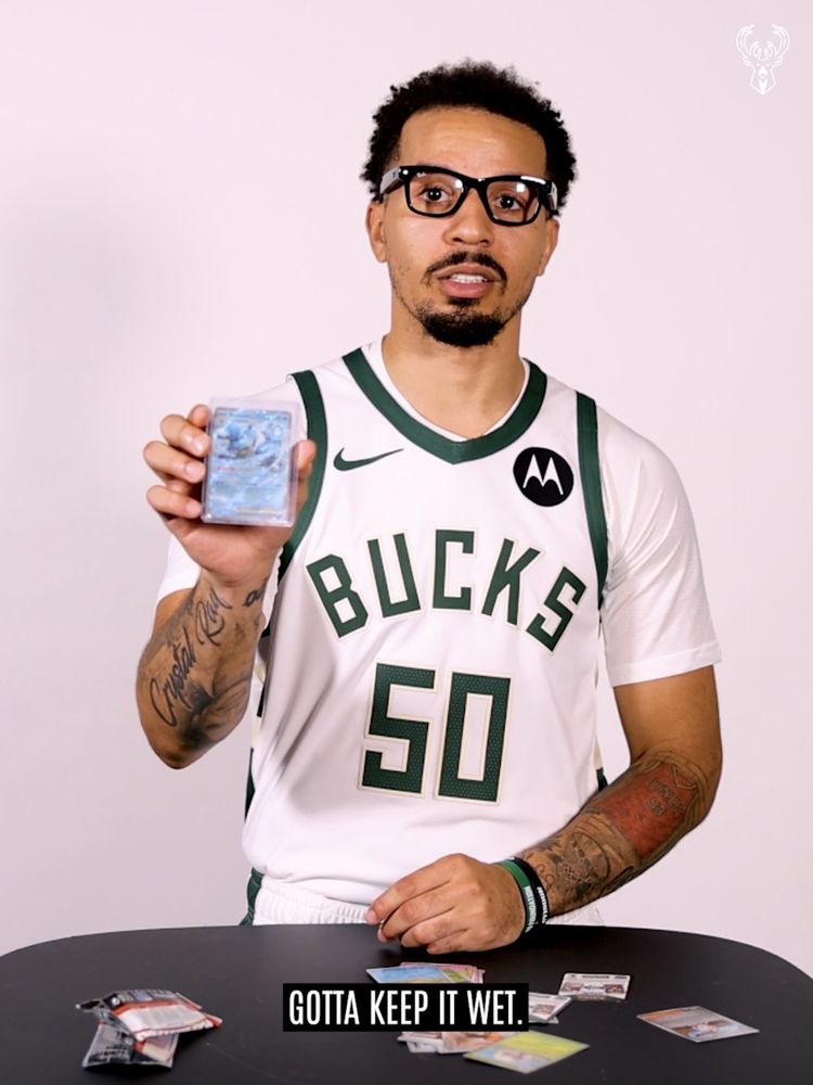 Cole Anthony holding a Pokemon TCG of Blastoise 