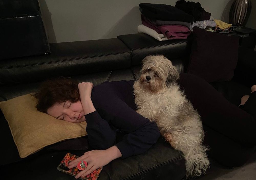 Lola sitting on my back while i napped on said couch