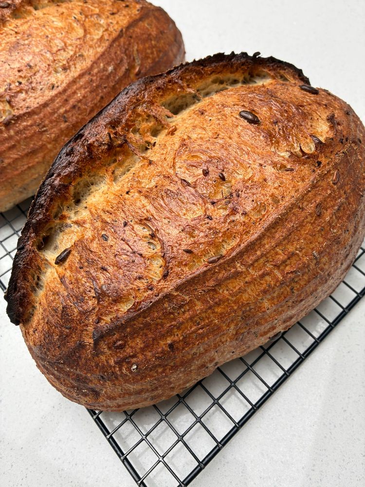 Sourdough showing gluten strands, seeds and sage.