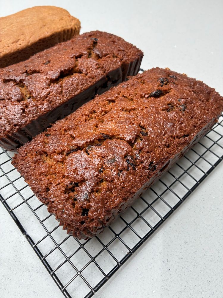 Dark brown textured Beer/fruit cake and ginger cake in the background.