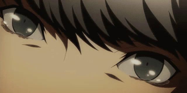 a close up of a person 's eyes with a tear coming out of them