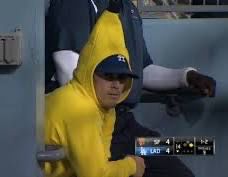 Kiké wearing a banana suit in the dugout