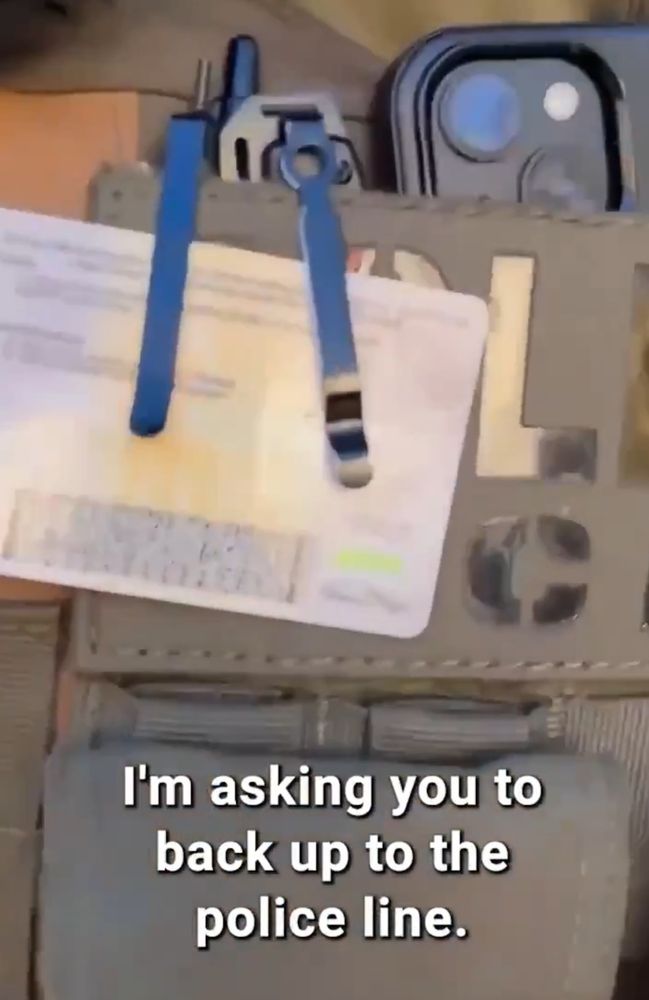 ID badge identifying the individual making the arrest in the video