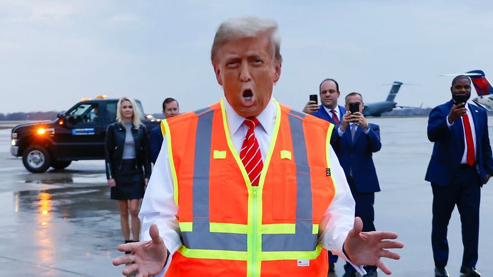 Trump in an orange vest.