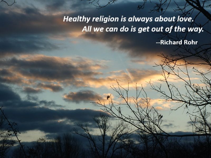 Shows morning clouds dark but tinged with light on a light blue sky.  Some bare branches in the foreground.  Quotation says: "Healthy religion is always about love.  All we can do is get out of the way." -- Richard Rohr