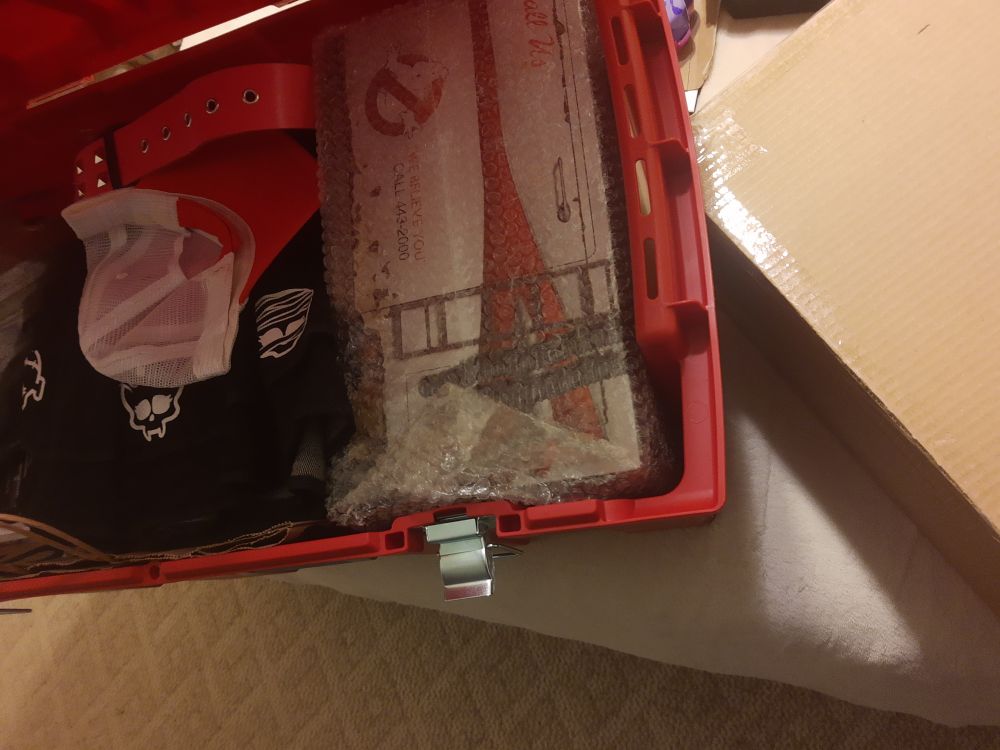 A picture of my full storage box next to the cardboard box most of the stuff was previously stored in